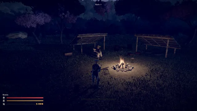 Rónin: camp with shelters and a fire at dusk